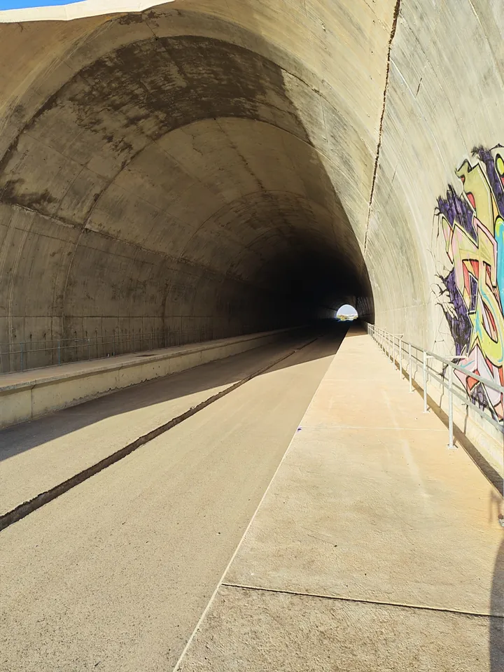 Through one of the rail tunnels